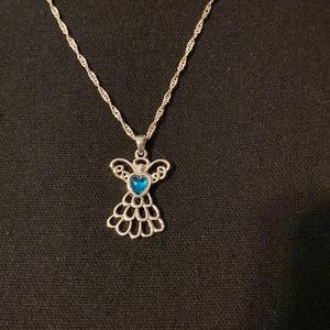 New in box Avon December birthstone Angel necklace with a bonus pin